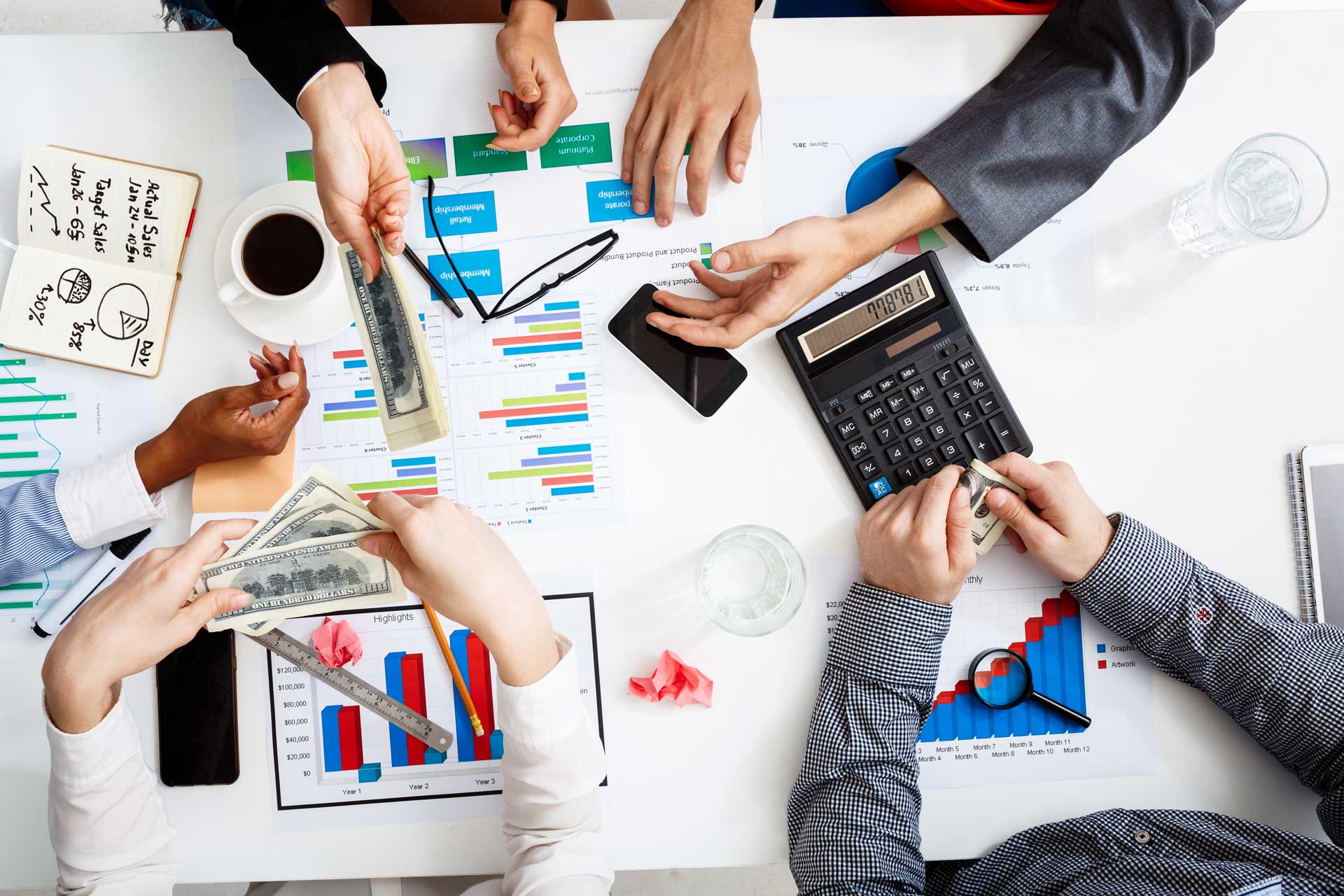 businessmen-hands-white-table-with-documents-drafts